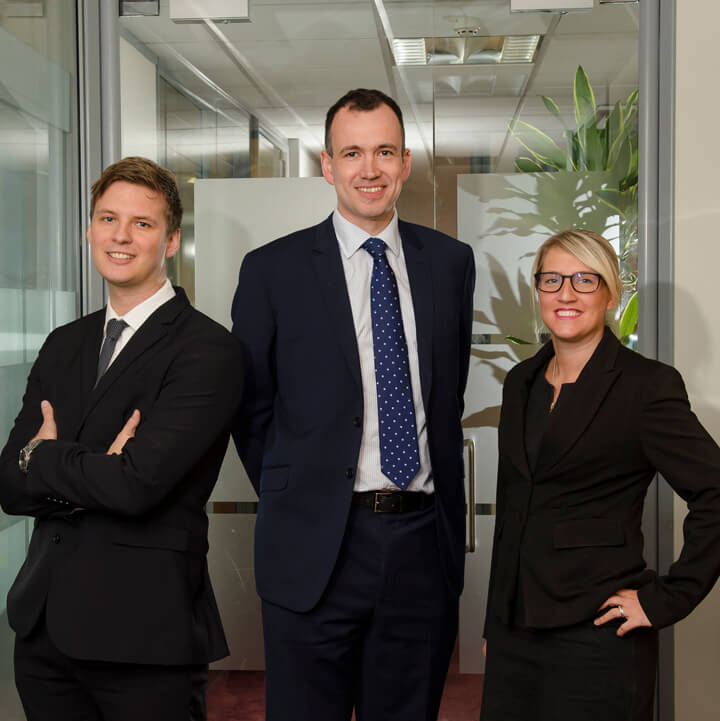 Newly appointed construction associates, Hayley Hayes, Associate (right) and Alex Jones, Associate (left) with Jules Harbage, Partner (Centre)