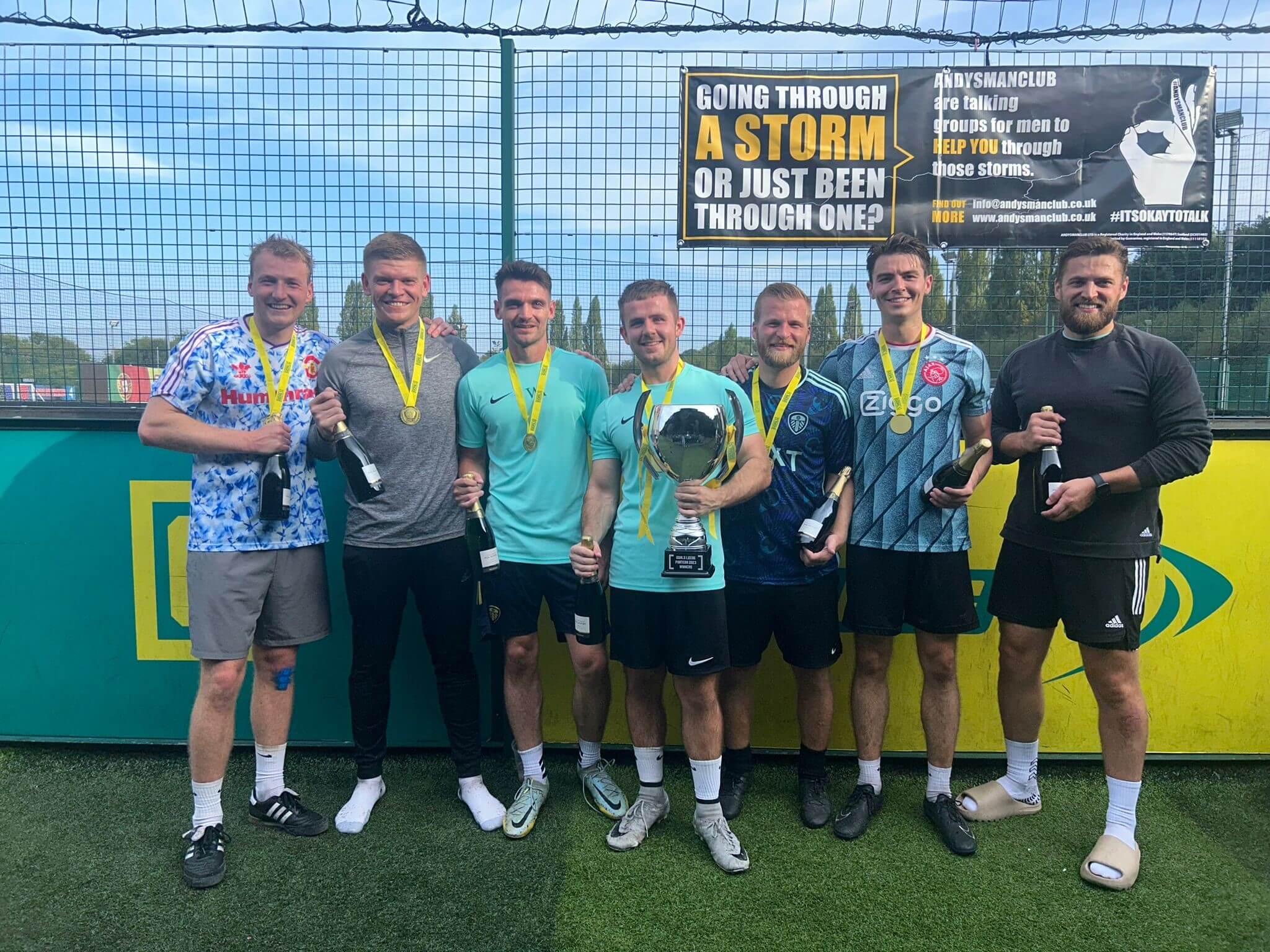 In colour photo of the Walker Morris 5-a-side team having won the Pantera Property Charity tournament