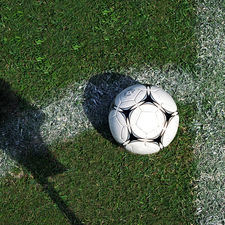 An image of a football on some grass. A visual metaphor for the topic of this article new rules for football clubs and gambling sponsors